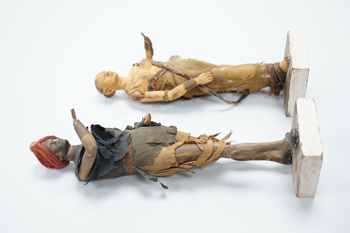 Two Indian clay figures, 26cm high
